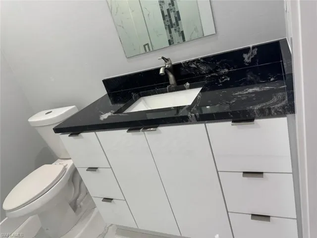 Half bath with toilet and vanity