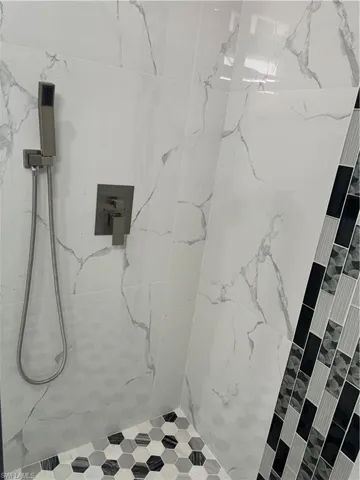Bathroom featuring a tile shower