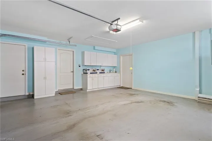Garage featuring a garage door opener
