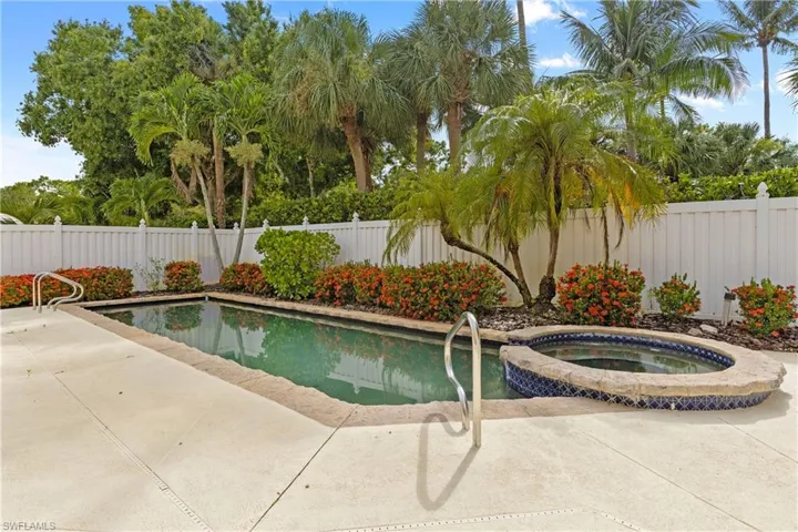 View of pool featuring an in ground hot tub and a patio