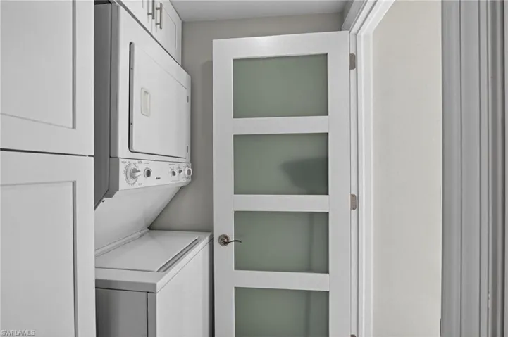 Laundry area with stacked washer / dryer