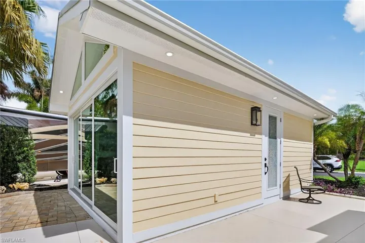 View of side of home featuring a patio