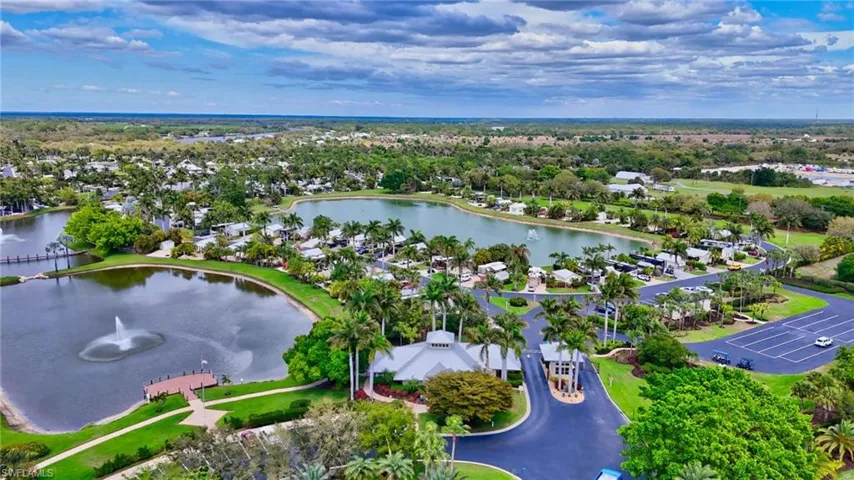 Aerial perspective of suburban area with a large body of water