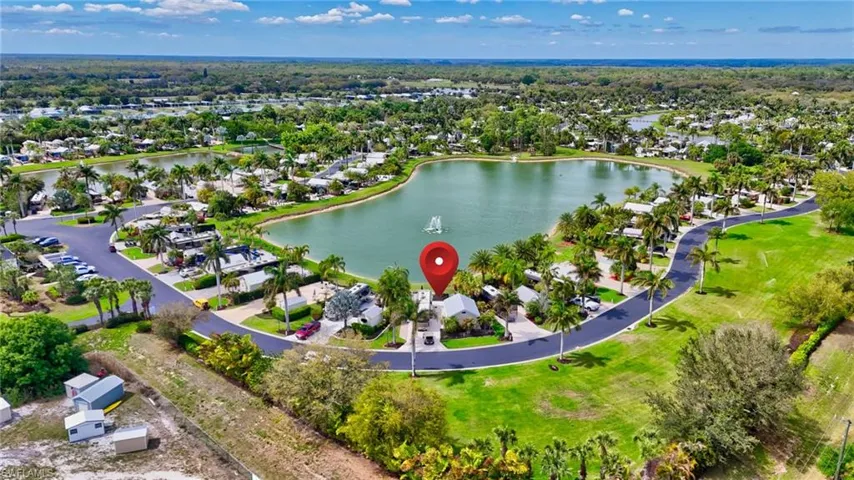 Aerial perspective of suburban area with a nearby body of water