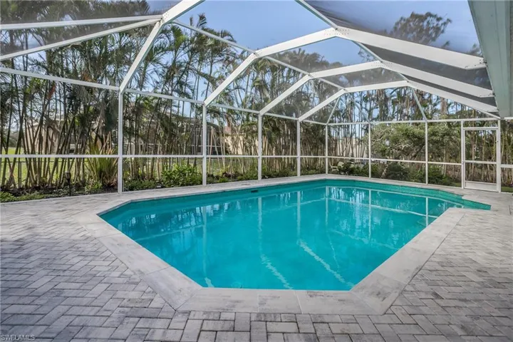 View of pool featuring a patio and a lanai