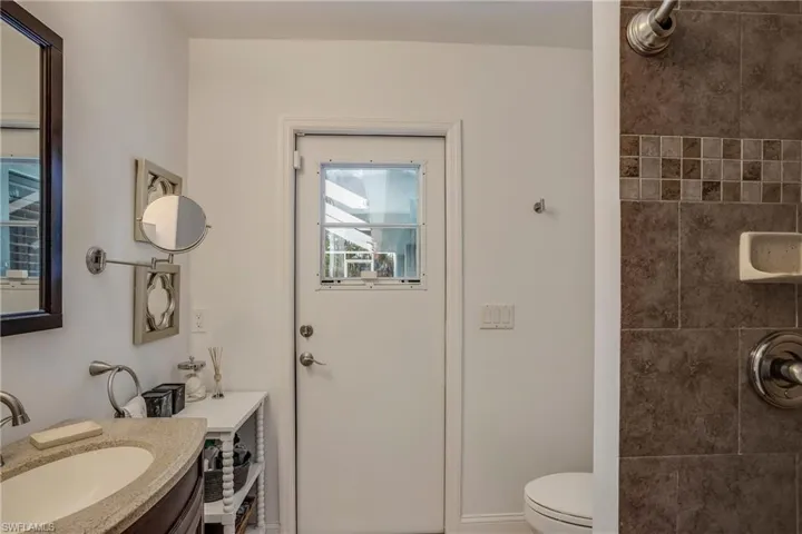 Bathroom with a tile shower and vanity