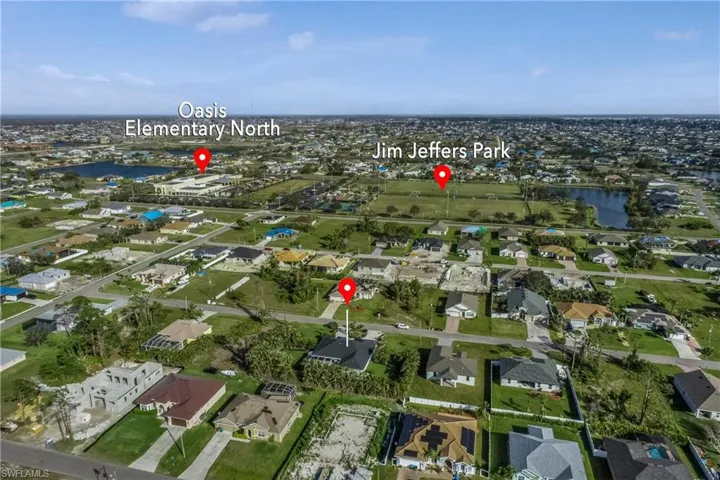 View of property location with a large body of water and nearby suburban area