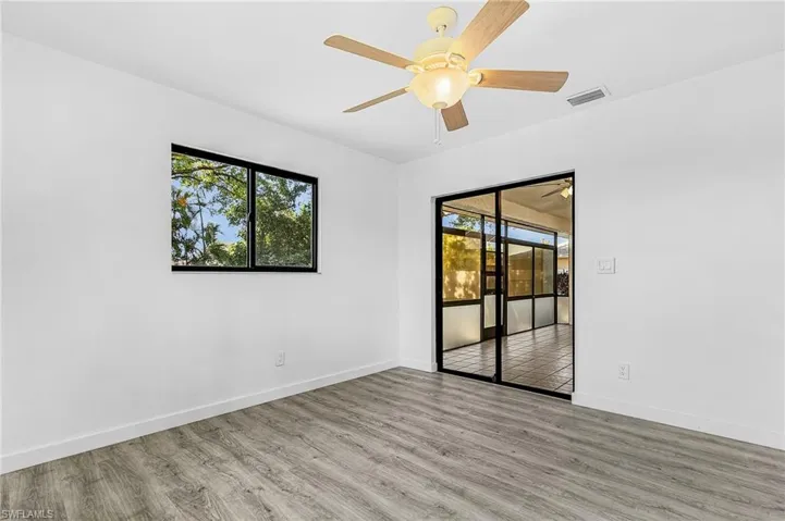 Light wood-finish flooring complements white walls