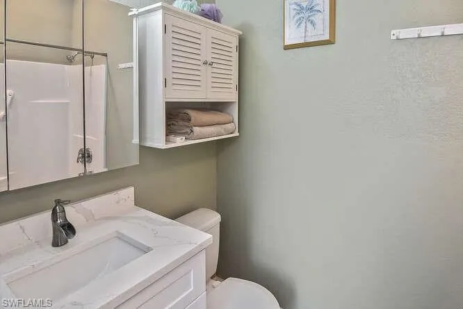 Bathroom with vanity and a shower