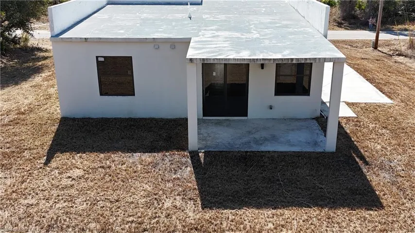 Back of house with a patio