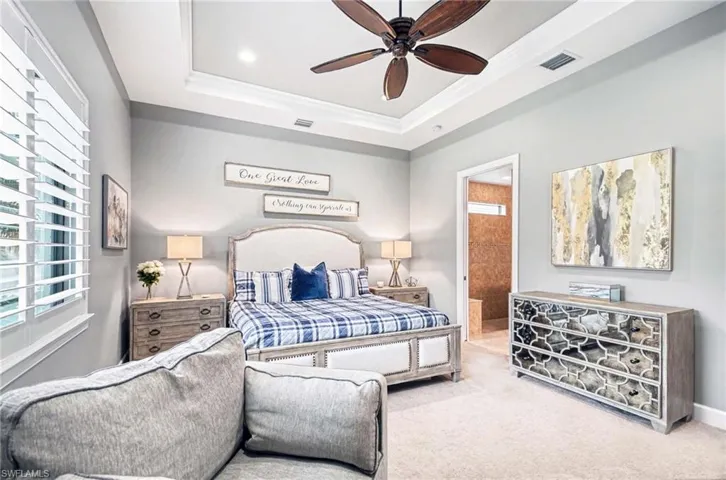 Carpeted bedroom featuring crown molding, ensuite bath, a ceiling fan, and recessed lighting