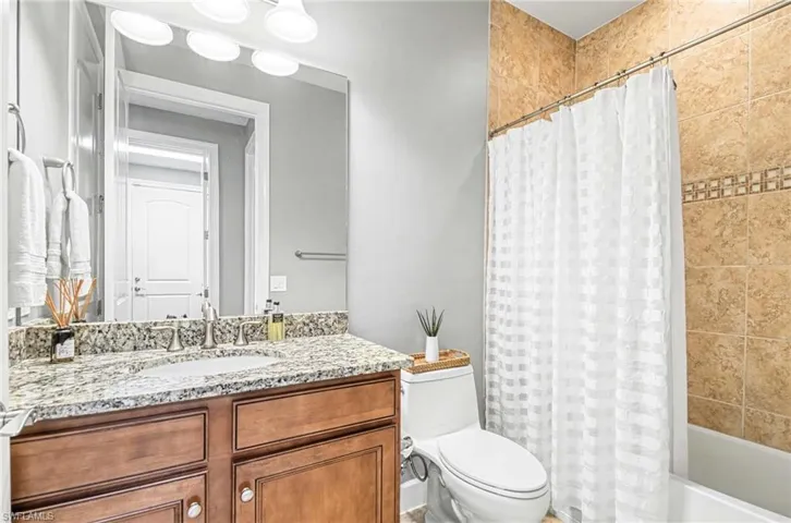 Bathroom with vanity and shower / bath combo