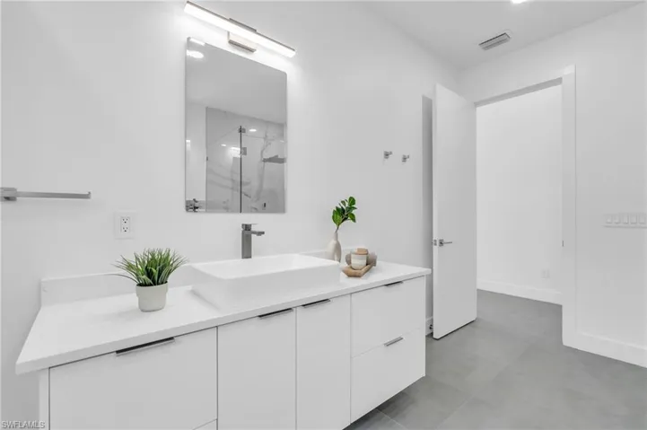 Bathroom featuring vanity and tile patterned flooring