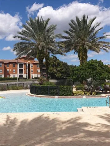 Community pool with a patio area