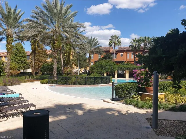 Community pool with a patio area