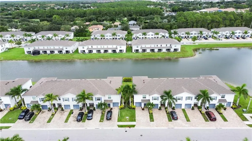 Aerial view of residential area featuring a large body of water