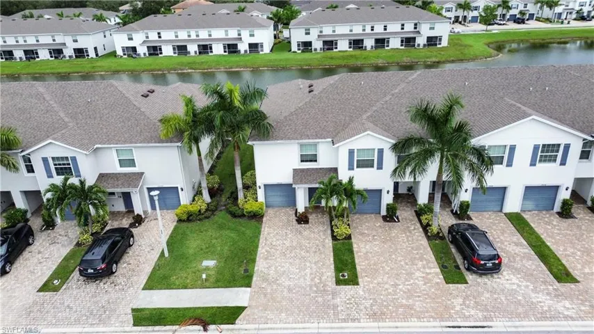 Aerial perspective of suburban area with a large body of water