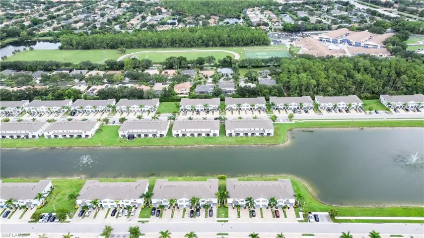 View of property location with a nearby body of water and nearby suburban area