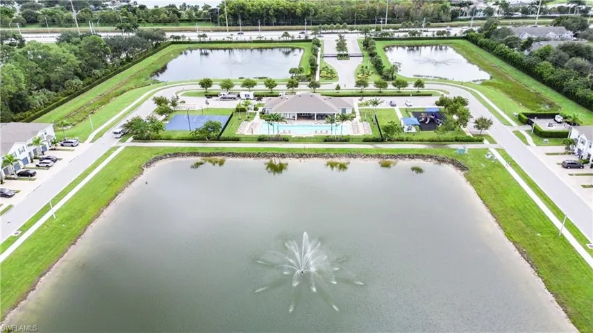 Bird's eye view of a nearby body of water and a tree filled landscape
