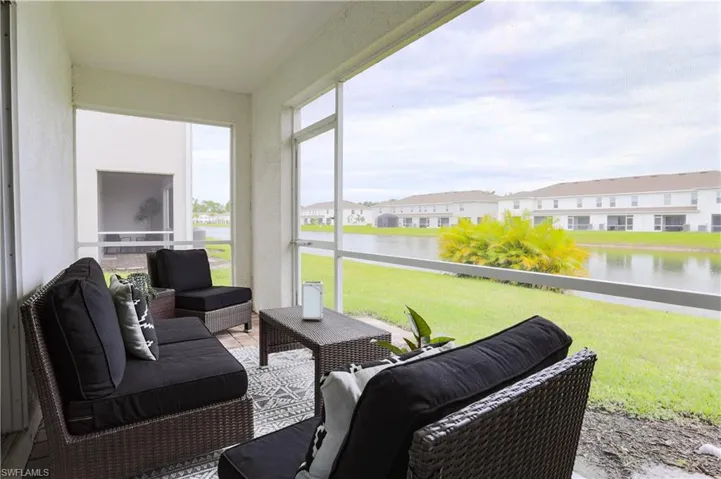 Sunroom featuring a water view, healthy amount of natural light, and an outdoor living space