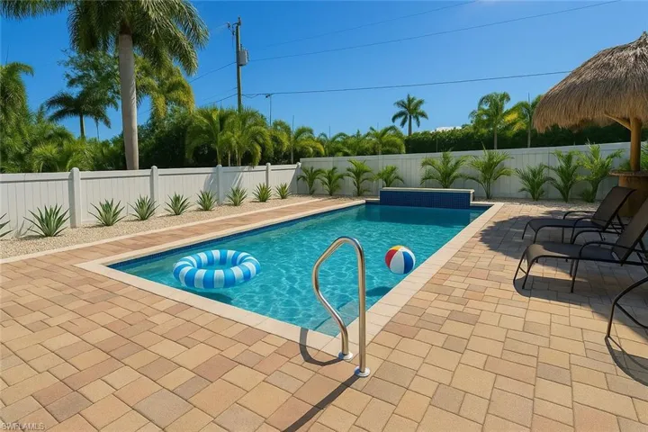 View of pool featuring a fenced backyard and a patio area