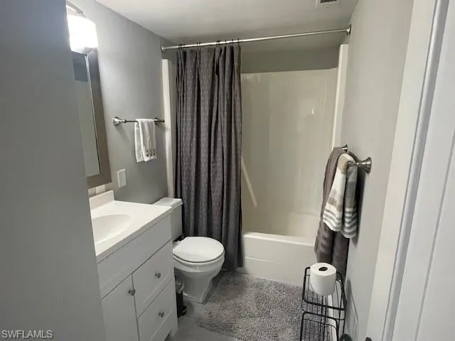 Full bath with vanity and shower / bathtub combination with curtain