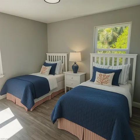 Bedroom featuring wood finished floors and a textured ceiling