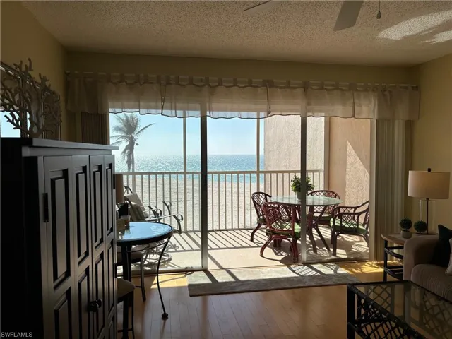 Sunroom with a water view
