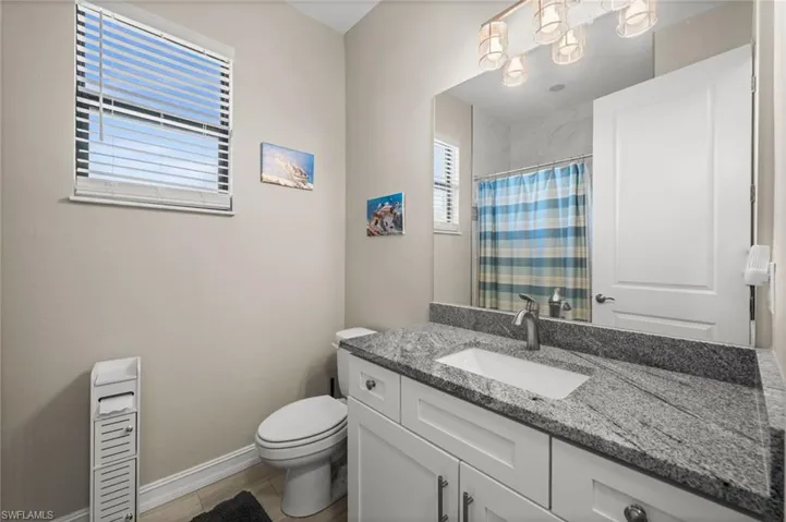 Full bath featuring a shower with curtain and vanity