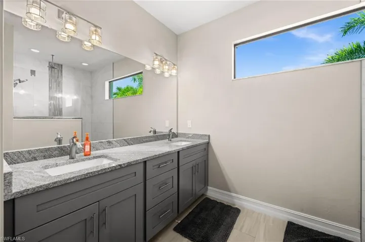 Full bath with double vanity and walk in shower