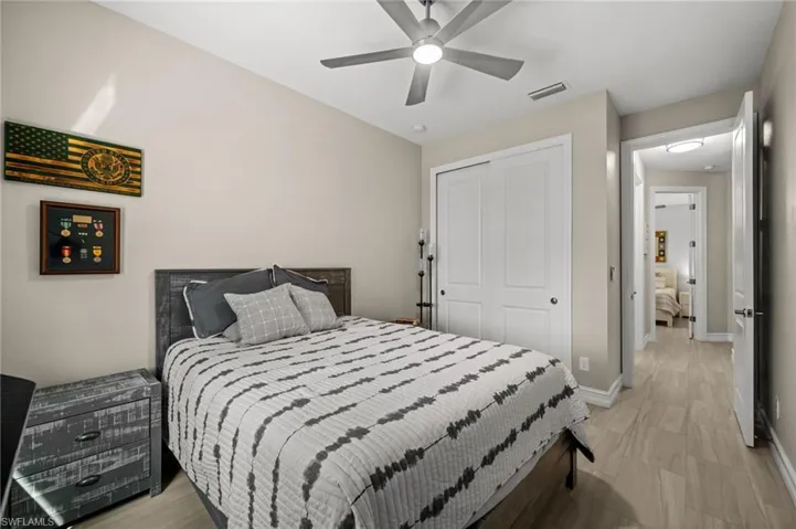 Bedroom featuring a closet and ceiling fan