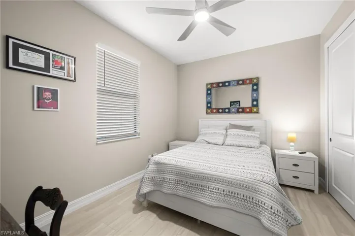 Bedroom featuring a ceiling fan and light wood-type flooring