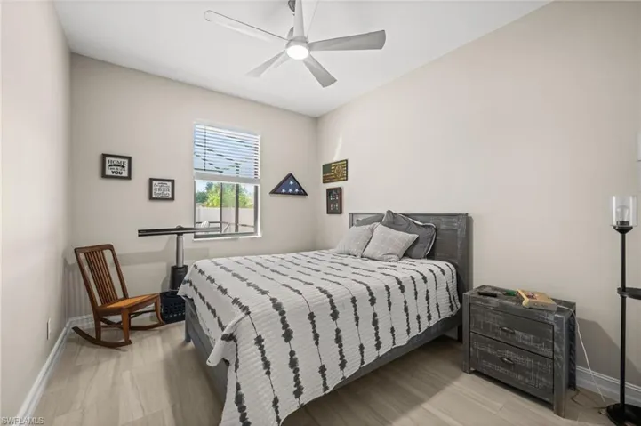 Bedroom featuring light wood-style floors and a ceiling fan