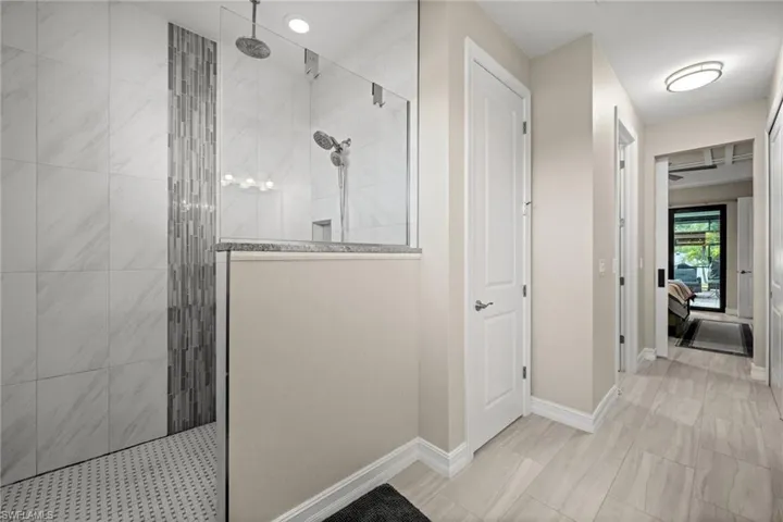 Ensuite bathroom featuring walk in shower