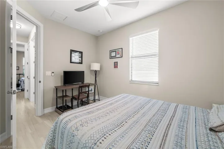 Bedroom featuring baseboards and ceiling fan