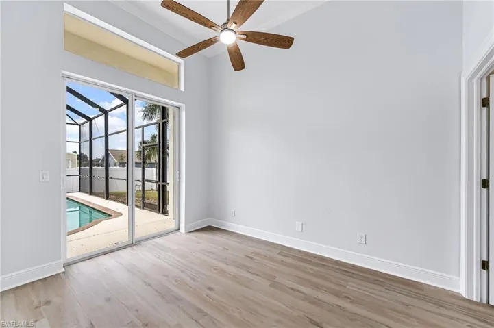 Empty room featuring light wood-type flooring and ceiling fan