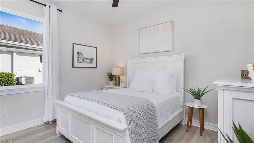 Bedroom#3 with ceiling fan and light hardwood / wood-style flooring