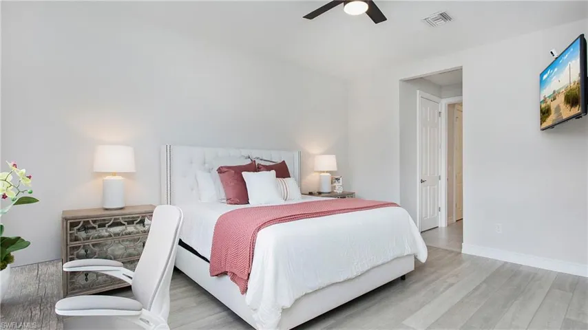Bedroom featuring light hardwood / wood-style floors and ceiling fan