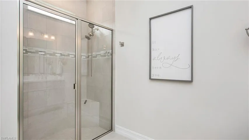 Bathroom with a shower with shower door