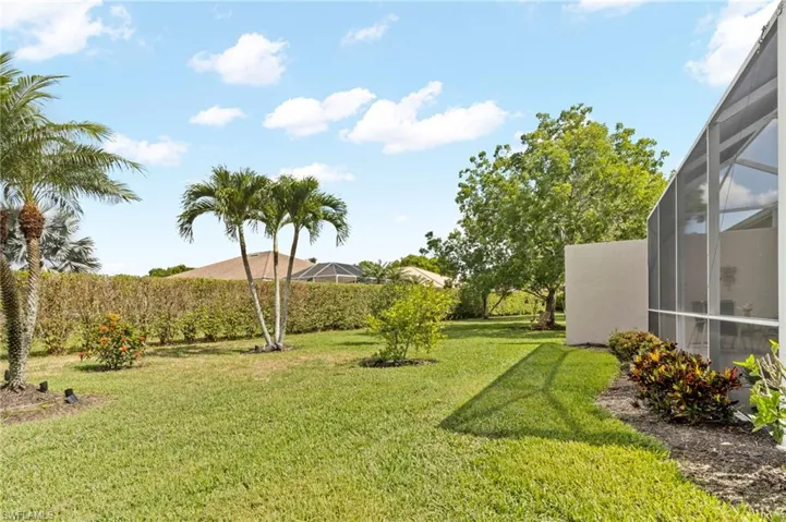 View of yard with a lanai