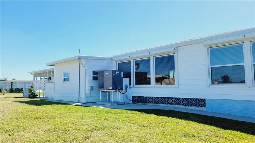 East side of home with raised AC/Heat