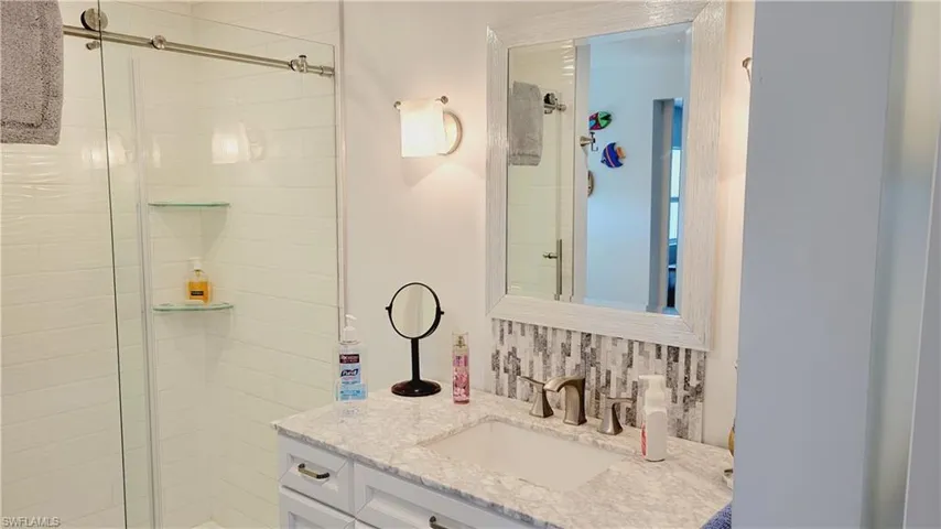 2nd Full bath with a stall shower and vanity