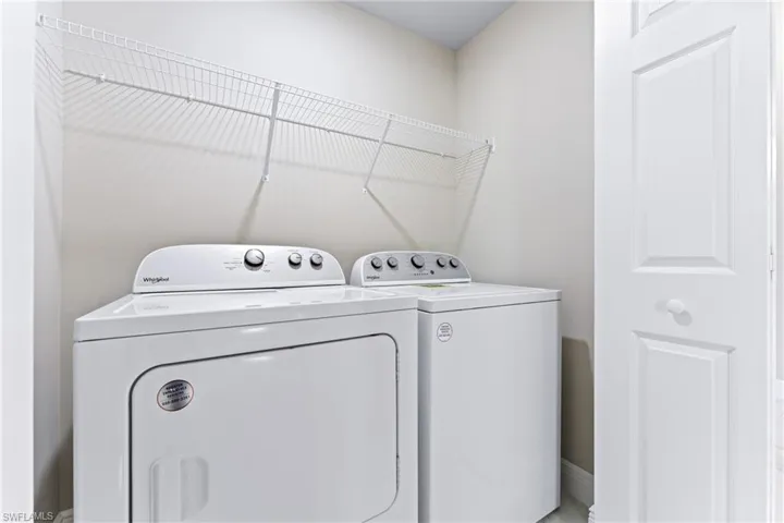Laundry room featuring separate washer and dryer