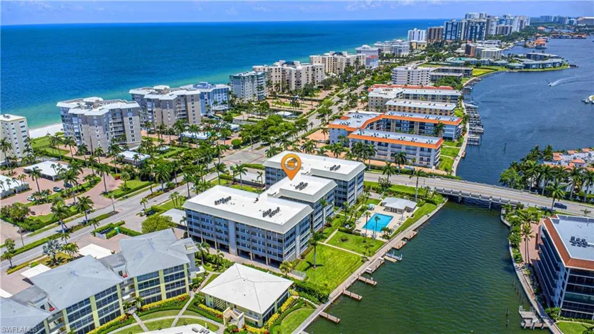 Aerial perspective showcasing a coastal community with multiple residential buildings
