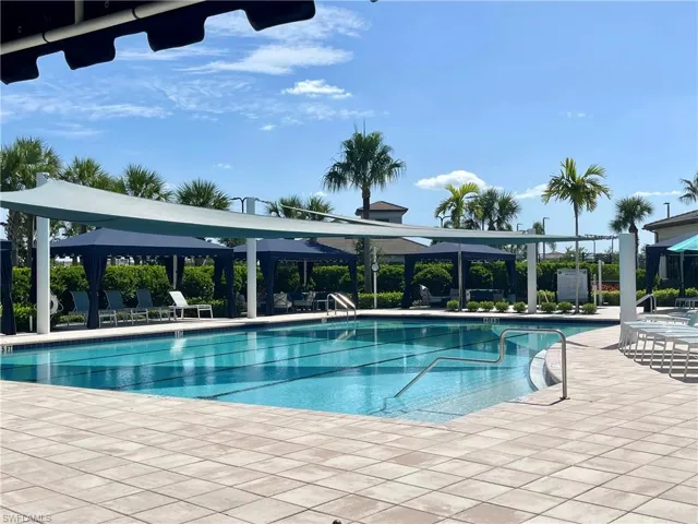 Community pool with a patio and a pergola