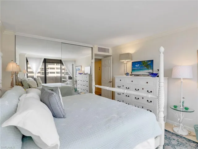 Bedroom featuring crown molding