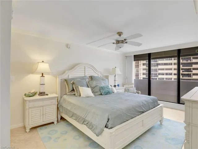 Bedroom featuring crown molding, ceiling fan, and access to exterior