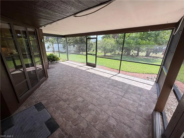 Unfurnished sunroom featuring healthy amount of natural light