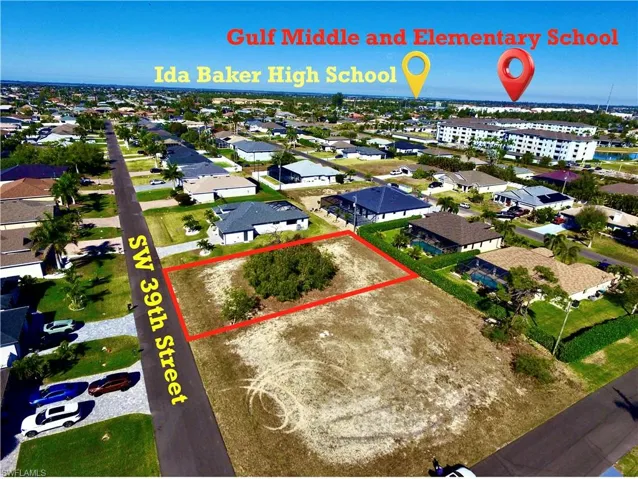 Aerial view of residential area featuring property boundaries highlighted
