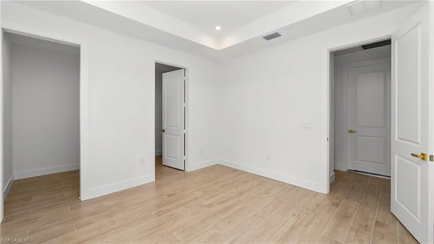 Unfurnished bedroom with light wood finished floors and recessed lighting